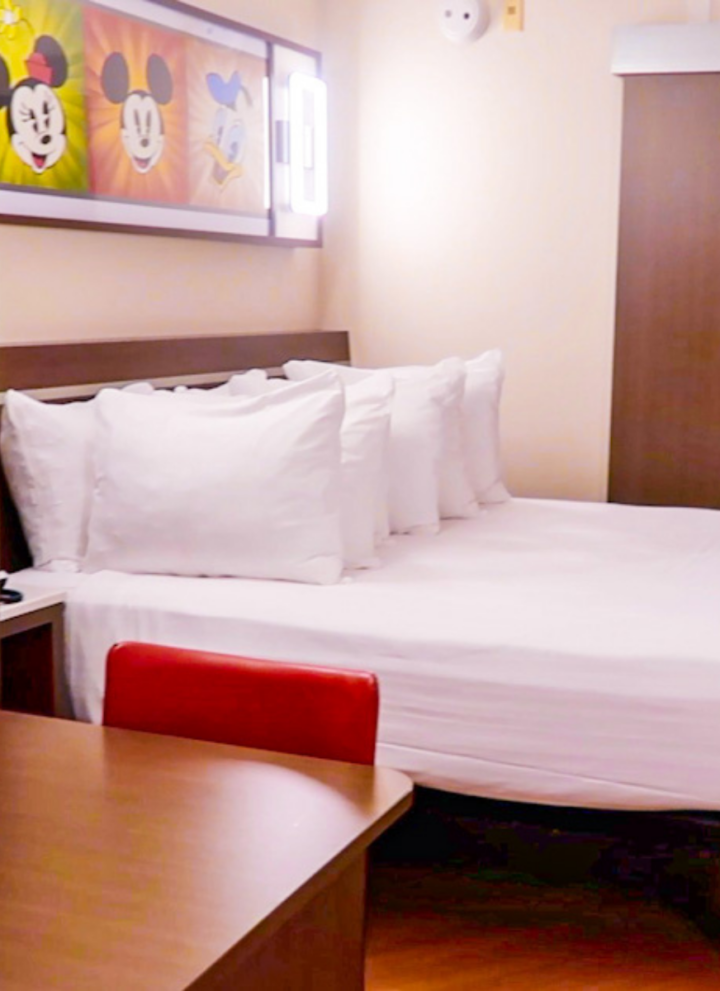 Shot of queen size bed in All Star Movies Standard Room