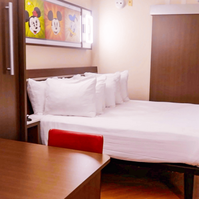 Shot of queen size bed in All Star Movies Standard Room