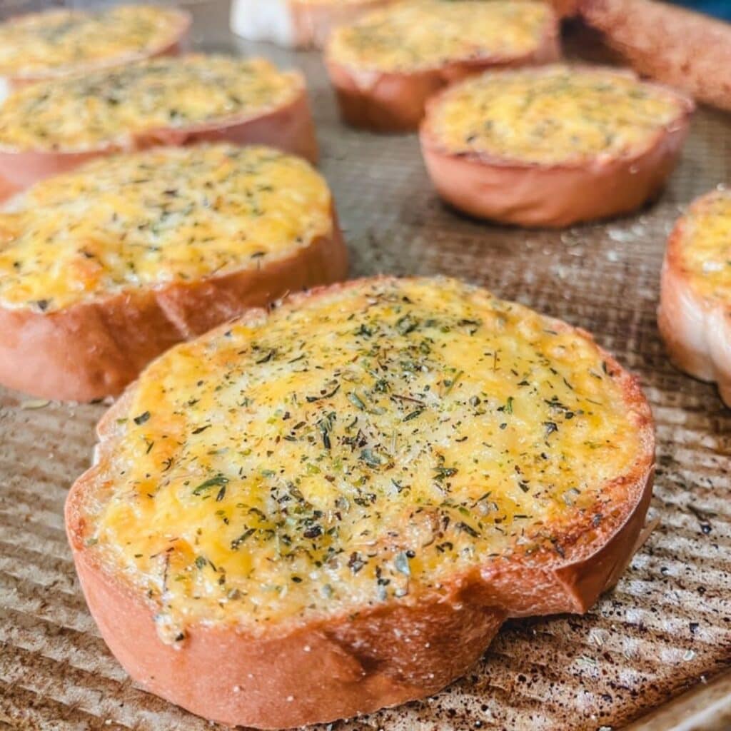 close up of cheesy garlic bread after being broiled