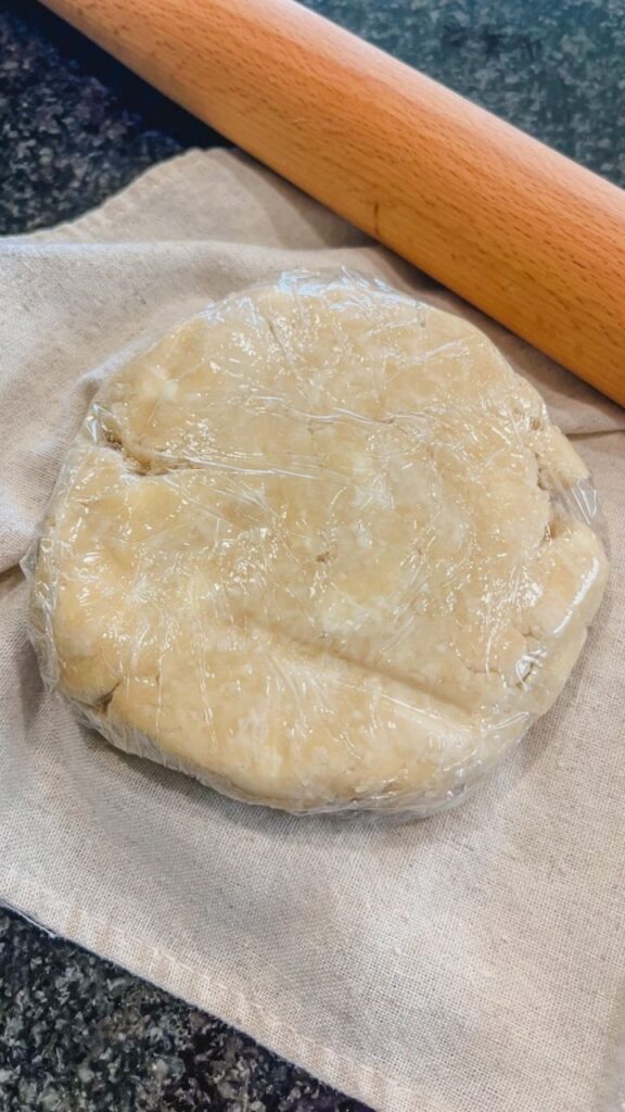 close up of simple butter pie crust wrapped pie dough ready to be rolled