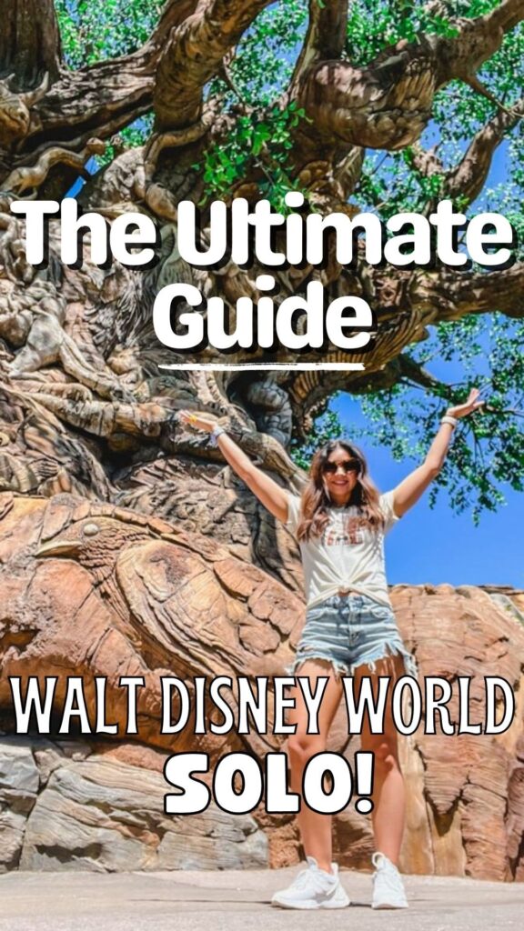 standing in front of the tree of life at animal kingdom park visiting disney world solo