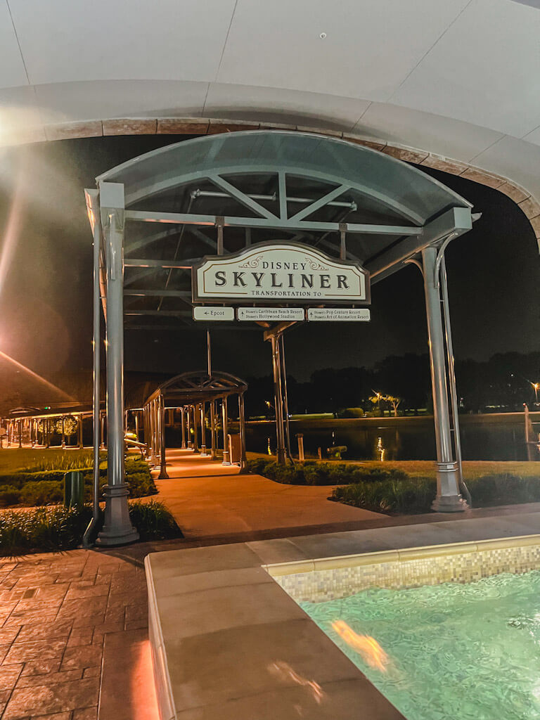 sign outside that reads, "Disney's Skyliner" to show the various lines to get in when riding the skyliner at Disney's Riviera Resort.