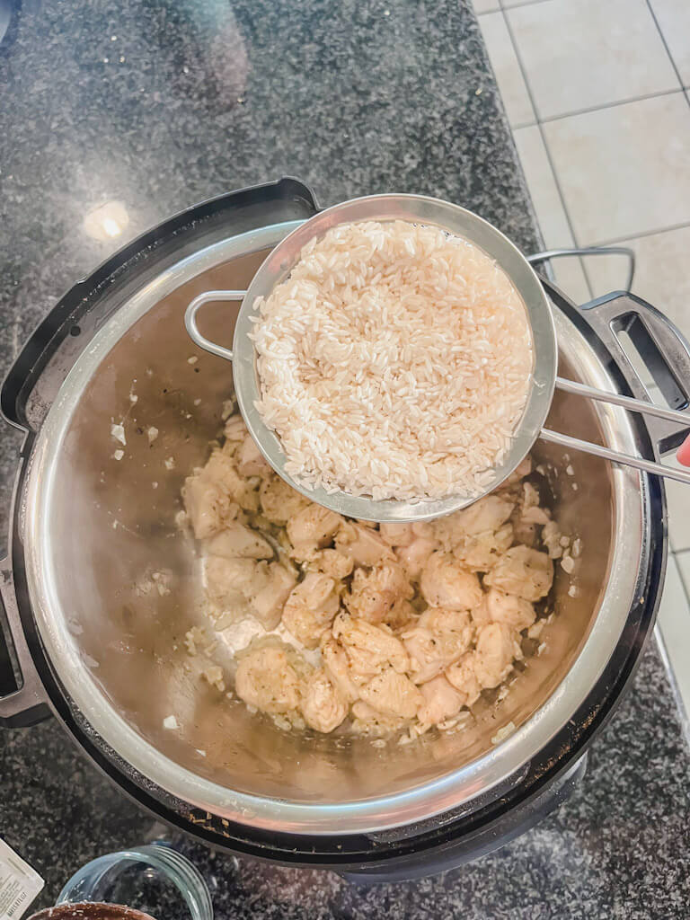 rinsed white rice about to be added to instant pot. 