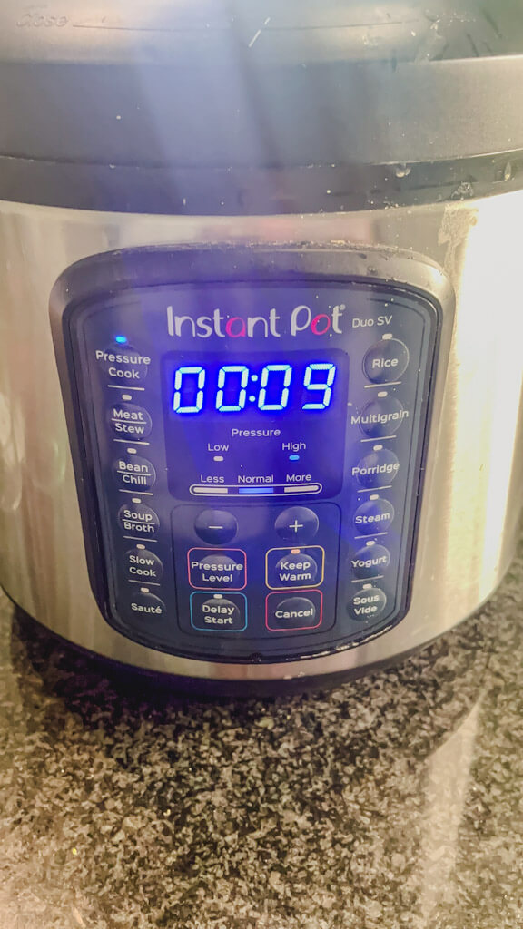 instant pot set to 9 minutes to cook chicken and rice casserole.