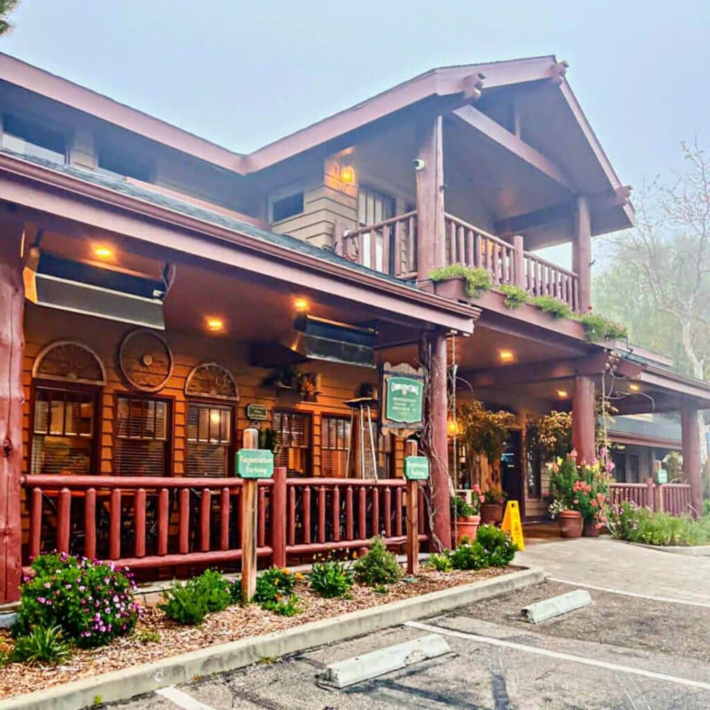 image of the main building of Cambria Pines Lodge from the outside.