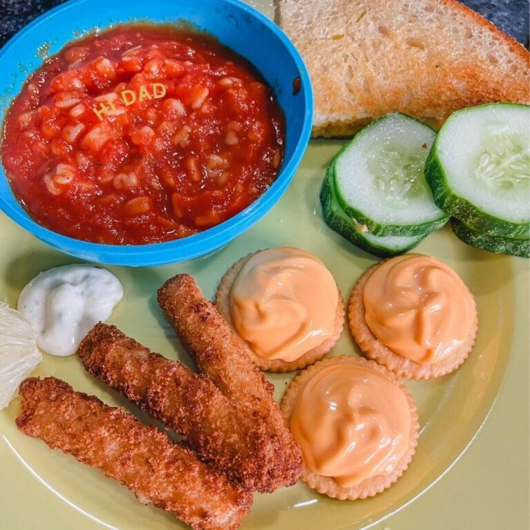 hi dad tomato soup, grilled cheese sandwiches, and cheese crackers on a yellow plate for a goofy movie dinner night.