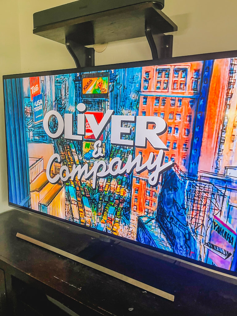 the title, "Oliver & Compnay" on the living room tv.
