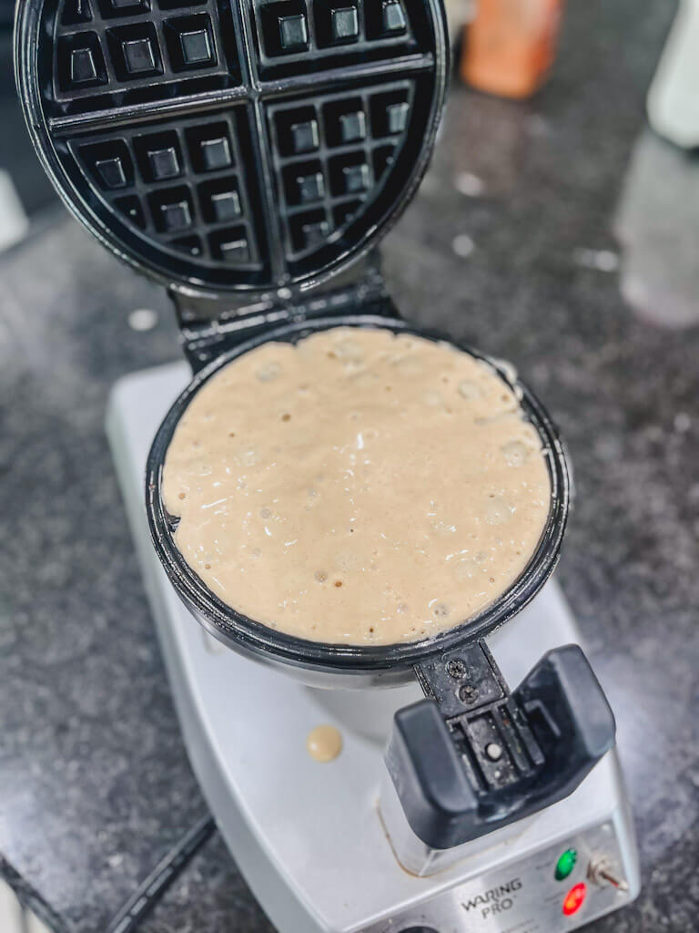 waffle batter poured into the preheated waffle iron.