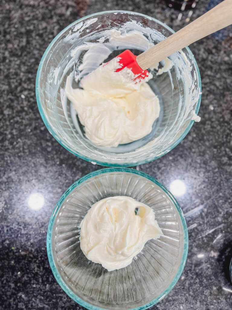 two clear glass bowls each with cream cheese mixture.