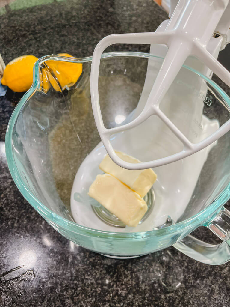 two sticks of butter in a stand mixer bowl.