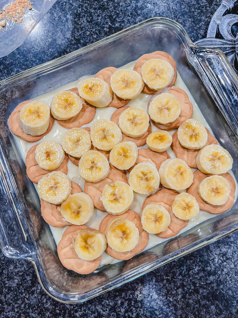 sliced bananas on top of the trefoils cookies.