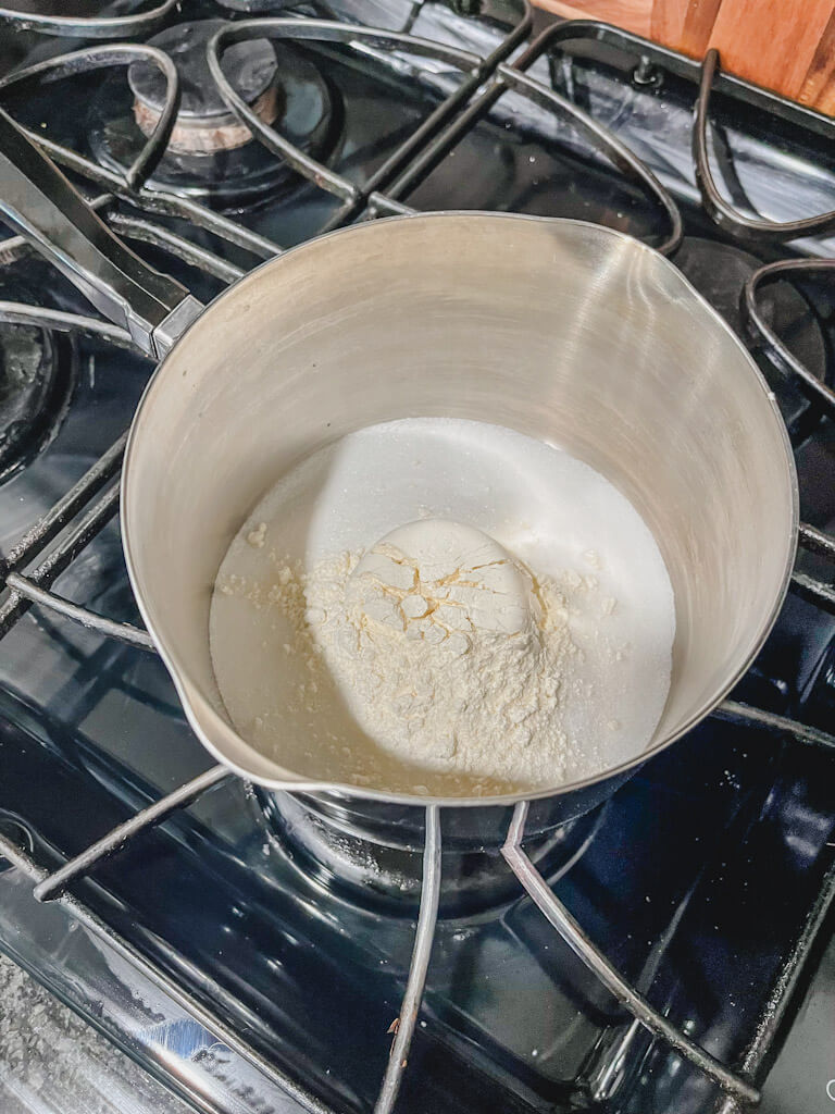 white flour added to the white sugar in a saucepan.