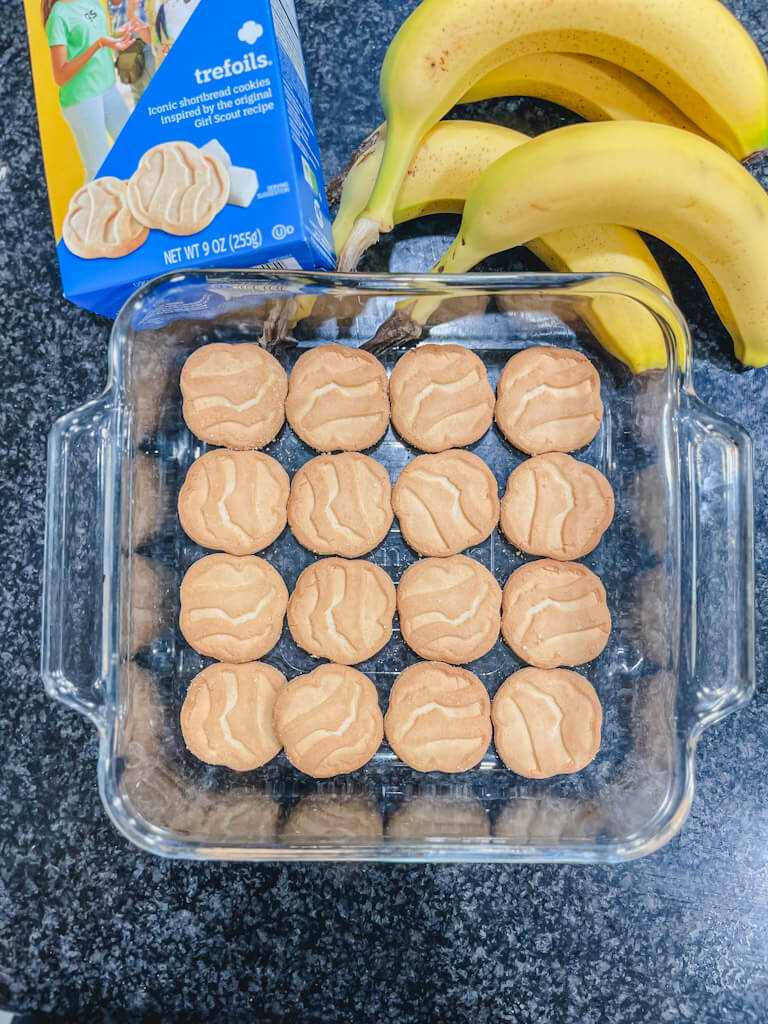 trefoils girl scout cookies in the bottom of a baking dish.