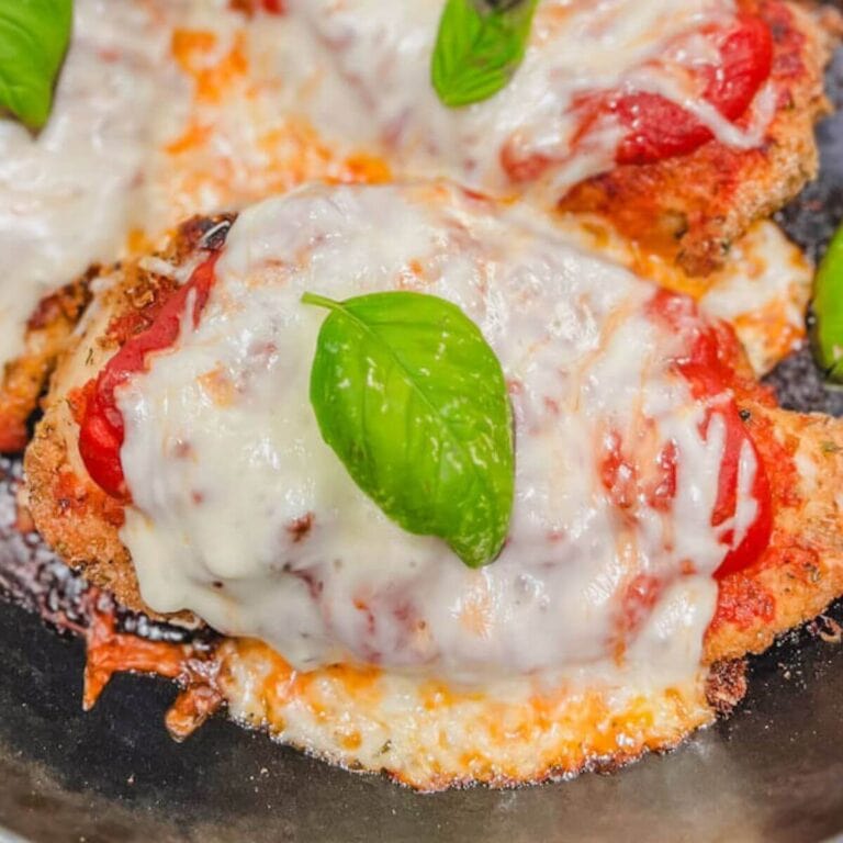 close up of one pan chicken parmesan in a cast iron skillet.