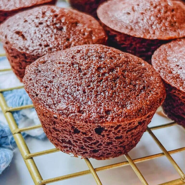 close up of a copycat little bites fudge brownie on a gold cooling rack.