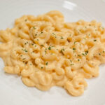 a large serving of macaroni and cheese on a plate.