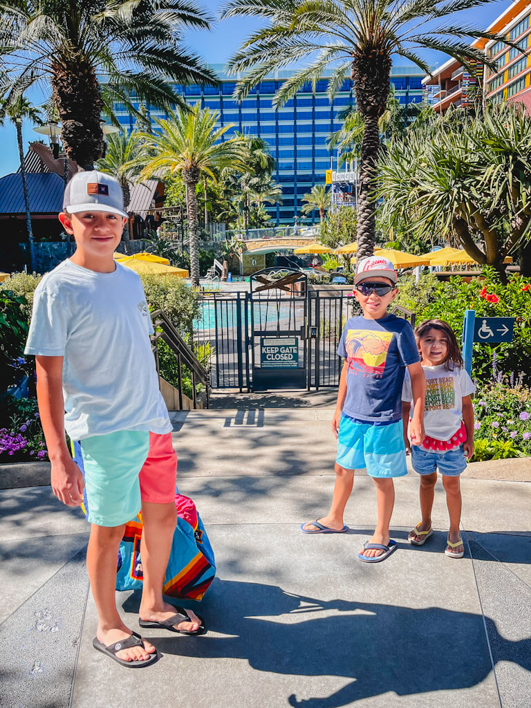 kids in front of the pool area at the Disneyland Resort.
