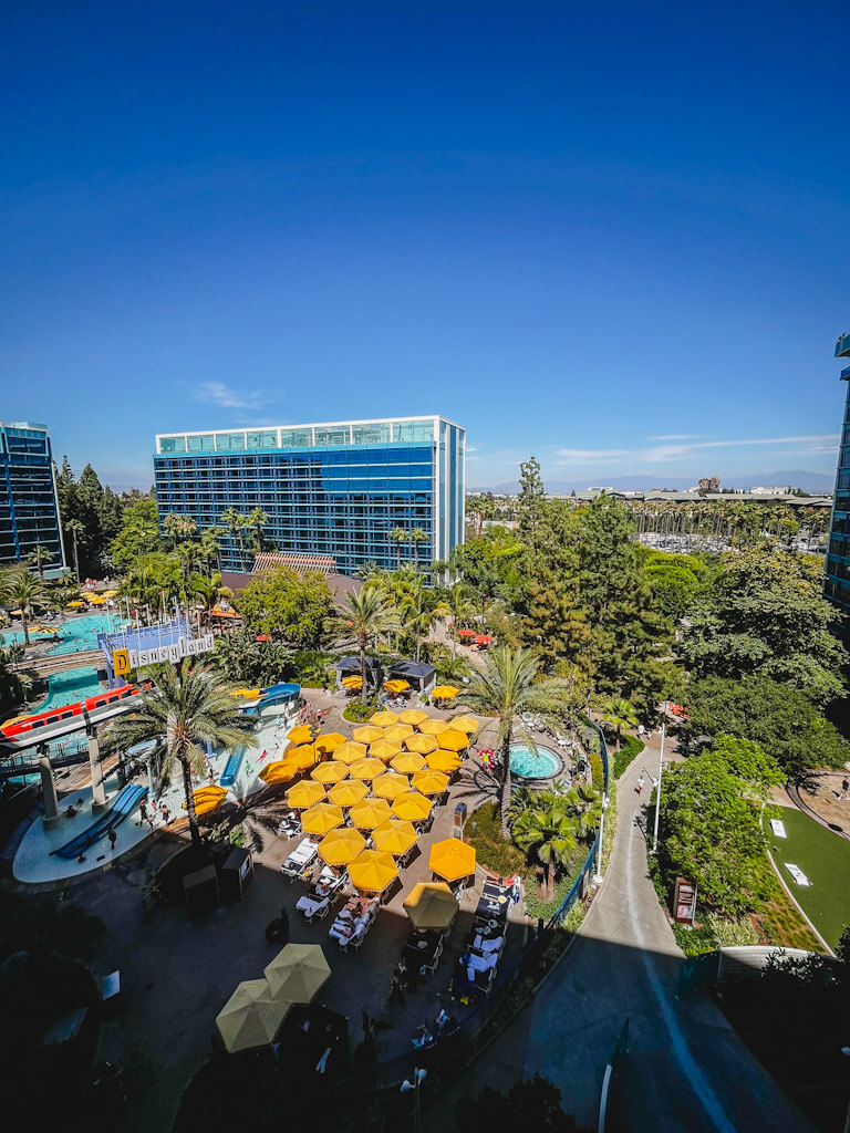 view of the pool area with the grand californian hotel in the distance.