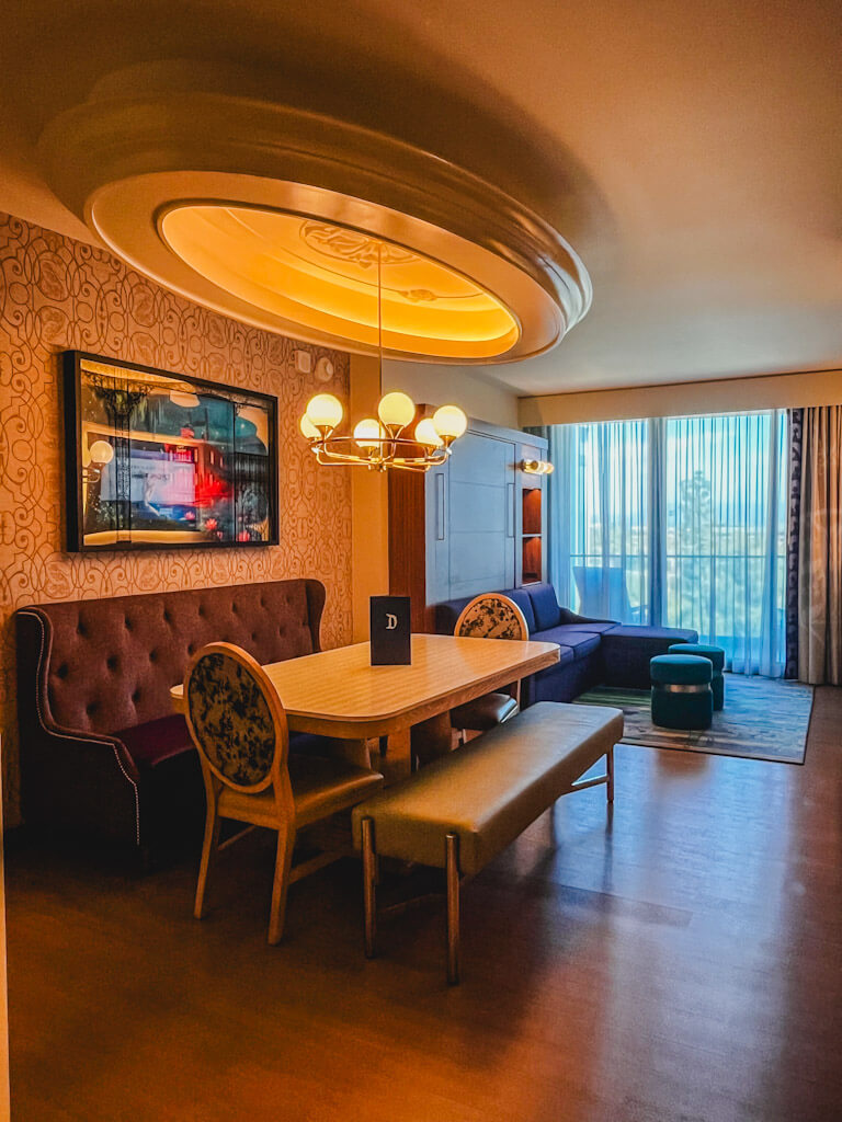 dining room table with chandelier in a one bedroom villa at Disneyland Hotel.