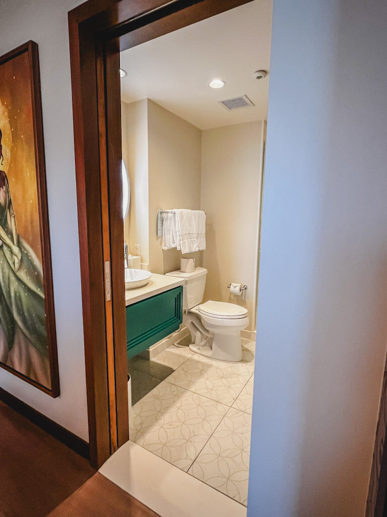 view of guest bathroom right off of the main living area in a one bedroom villa at Disneyland Hotel.