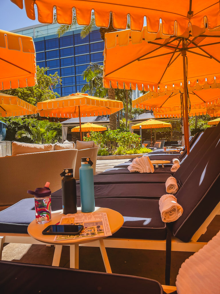cozy loungers poolside of the monorail slide.