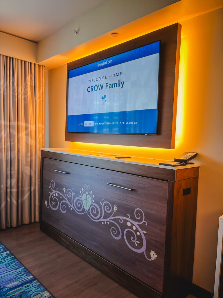 tv and hidden murphy bed in a one bedroom villa at Disneyland Hotel.