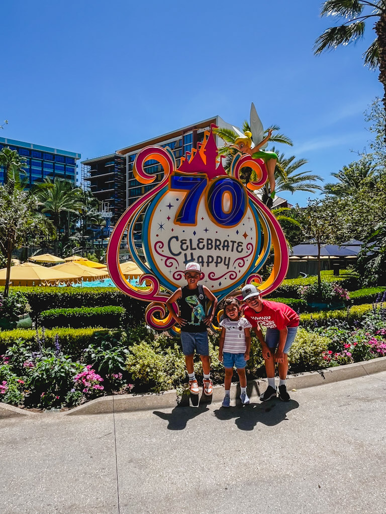 three kids exploring the grounds of the Disneyland Hotel.