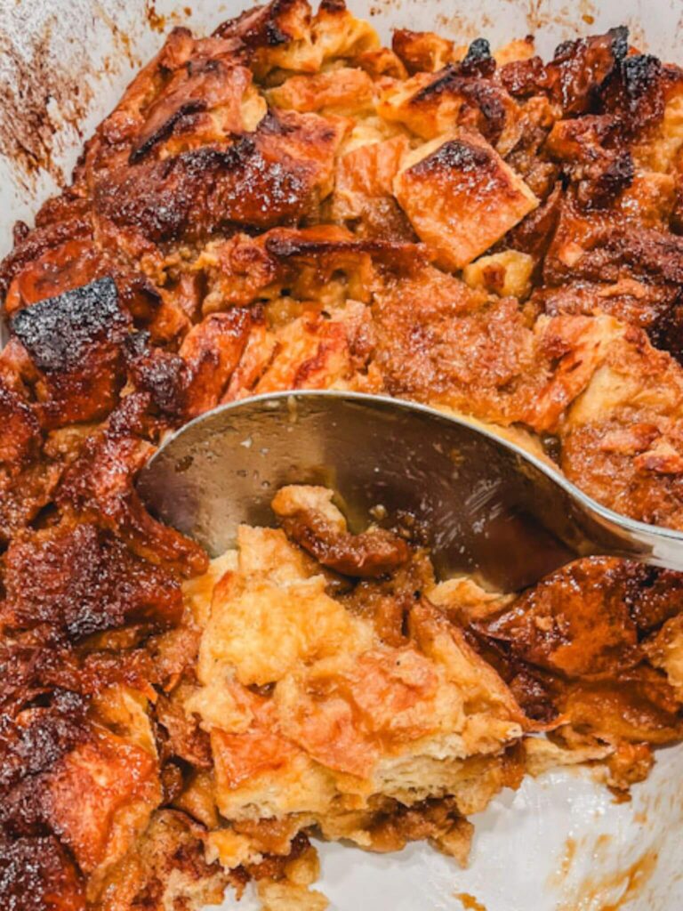 close up picture of the French toast casserole with a serving spoon.