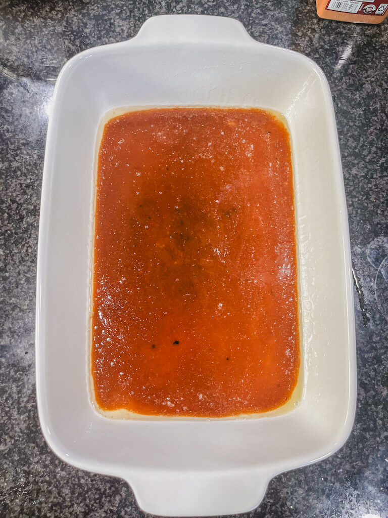the brown sugar caramel poured into a greased baking dish for overnight French toast casserole.