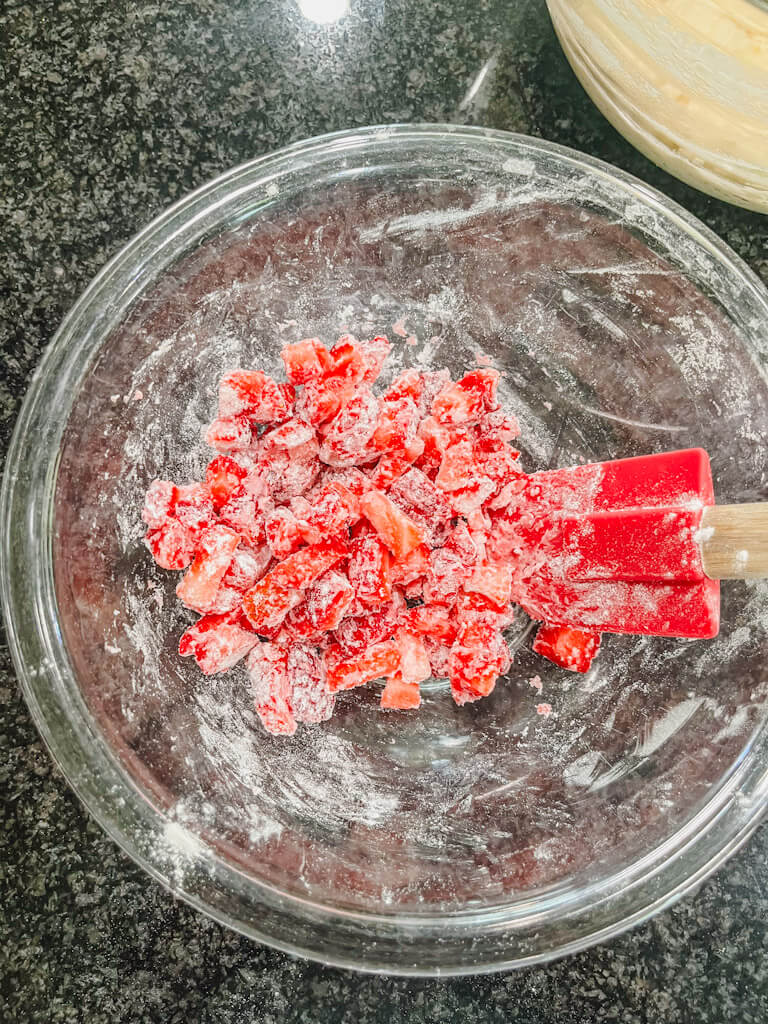 a small bowl with diced strawberries and flour mixed together.