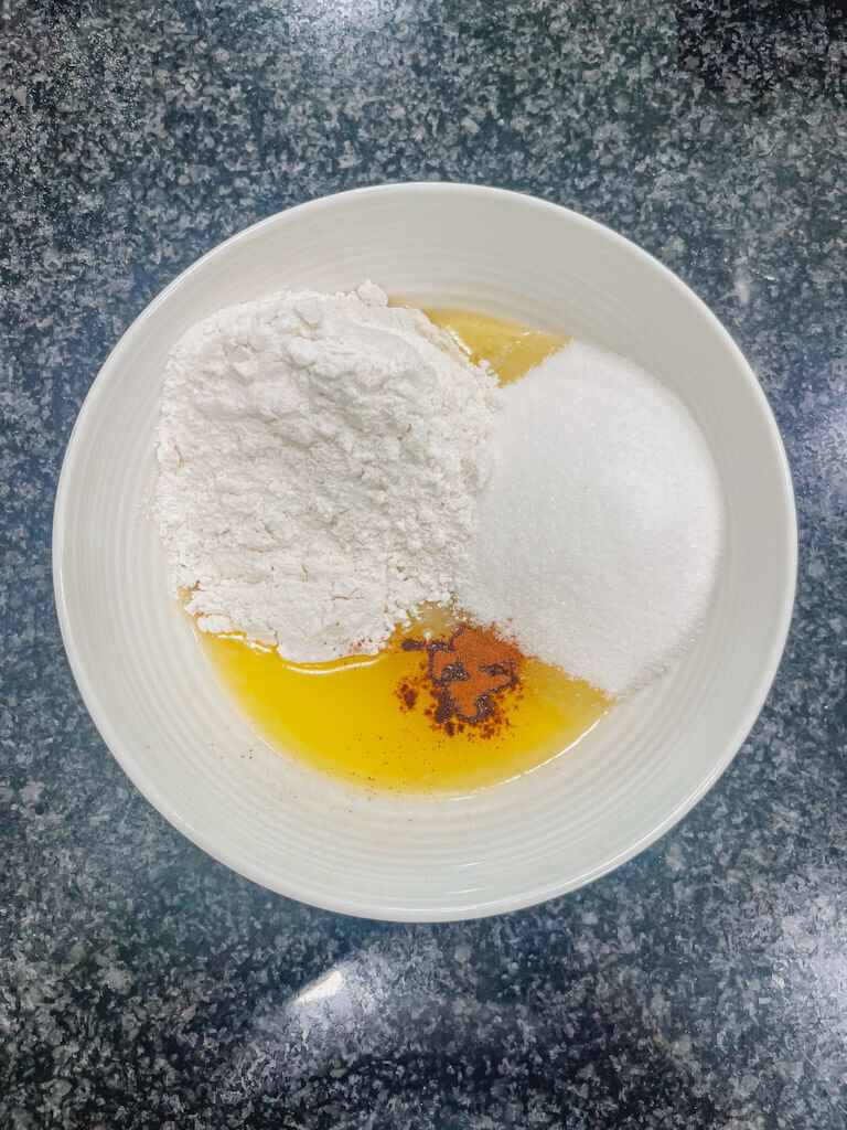 white flour, sugar, and cinnamon added to the cooled butter.