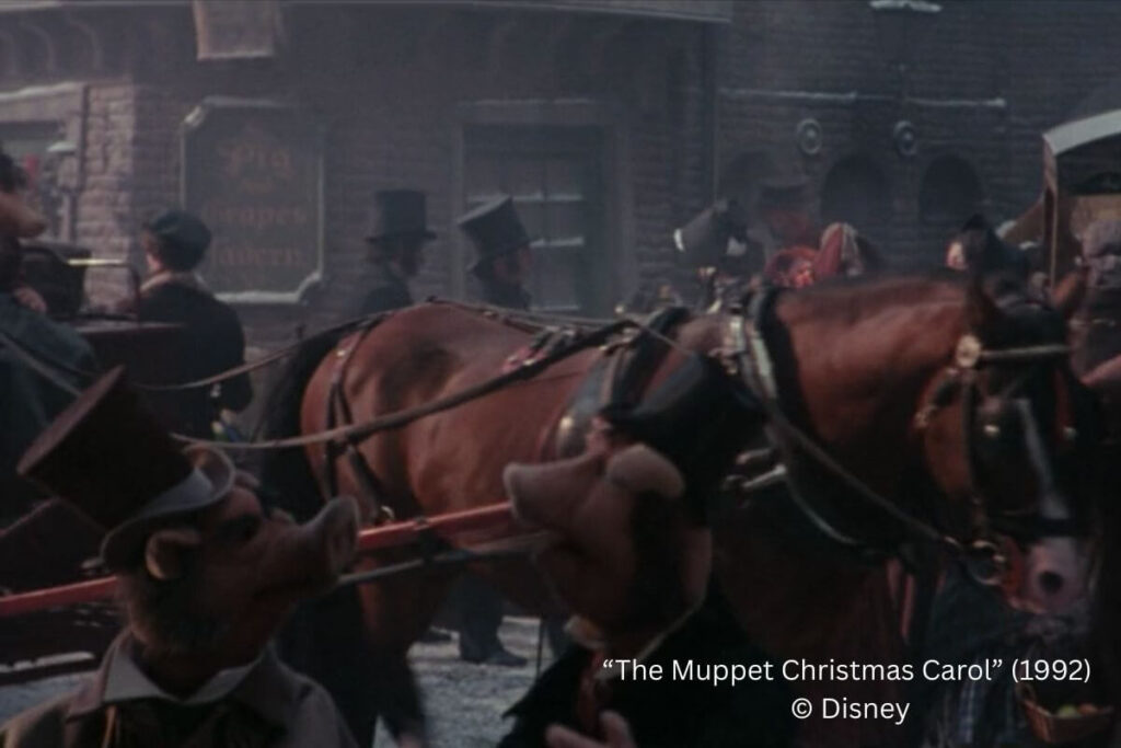 "The Pig and Grapes Tavern" sign in the background of the hustle and bustle.