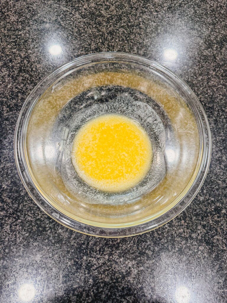 melted butter in a glass mixing bowl.