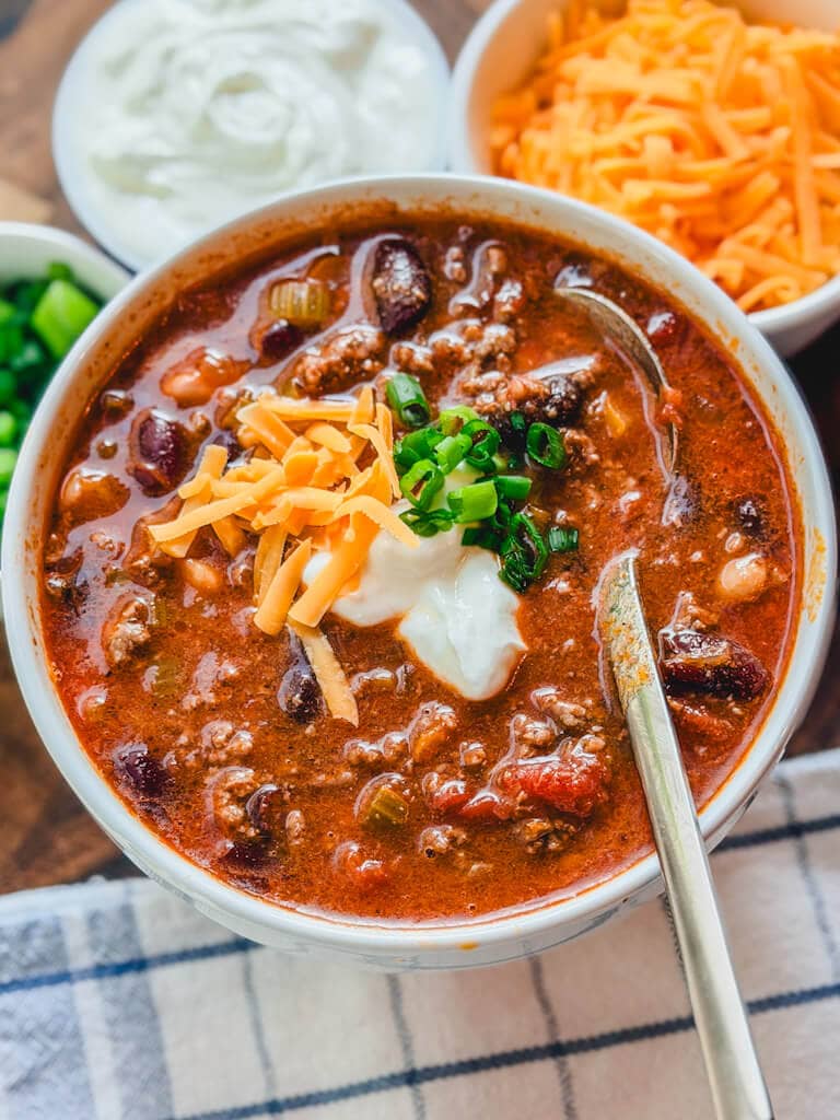 a white bowl holding a serving of chili beans.