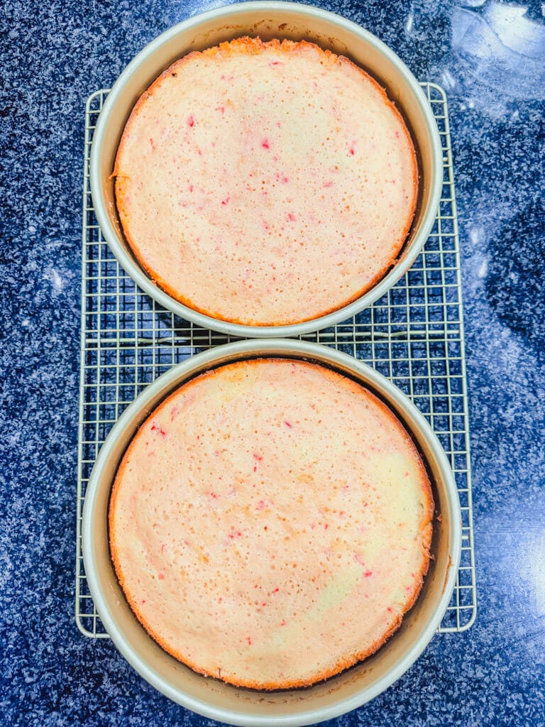 Cherry chip cake after being removed from the oven in the cake pans.