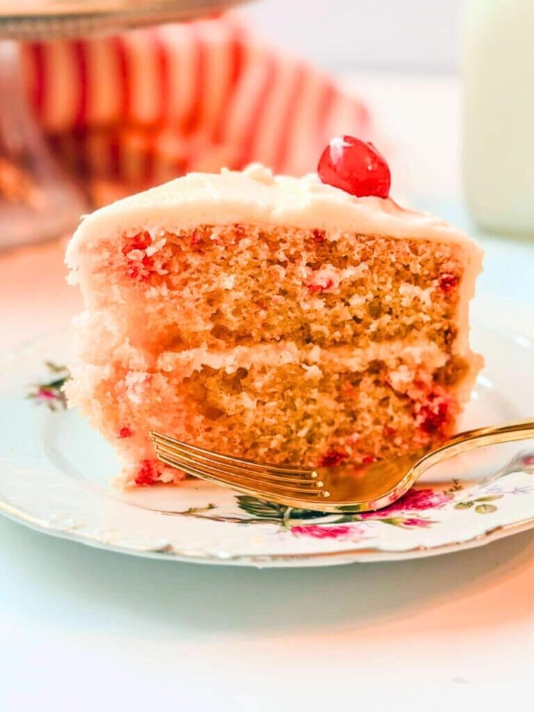 close up of a slice of cake on a pretty floral plate.