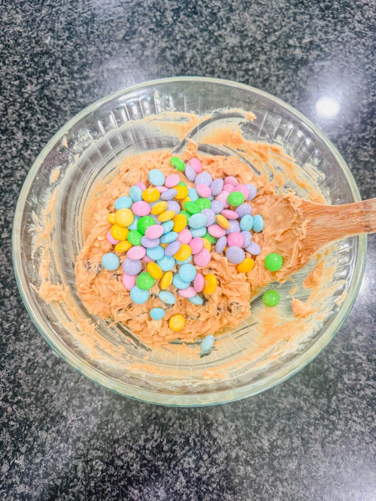 Pastel colored M&M's added to the cookie dough.