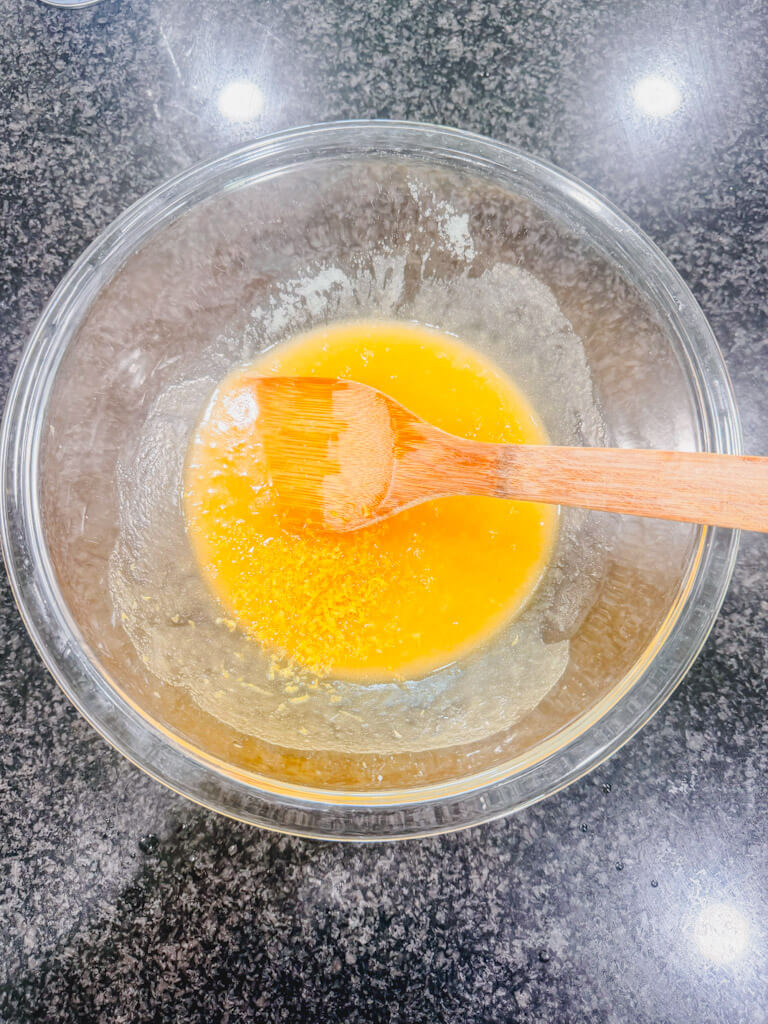 Fresh lemon zest added to the wet ingredients for strawberry lemon bars.
