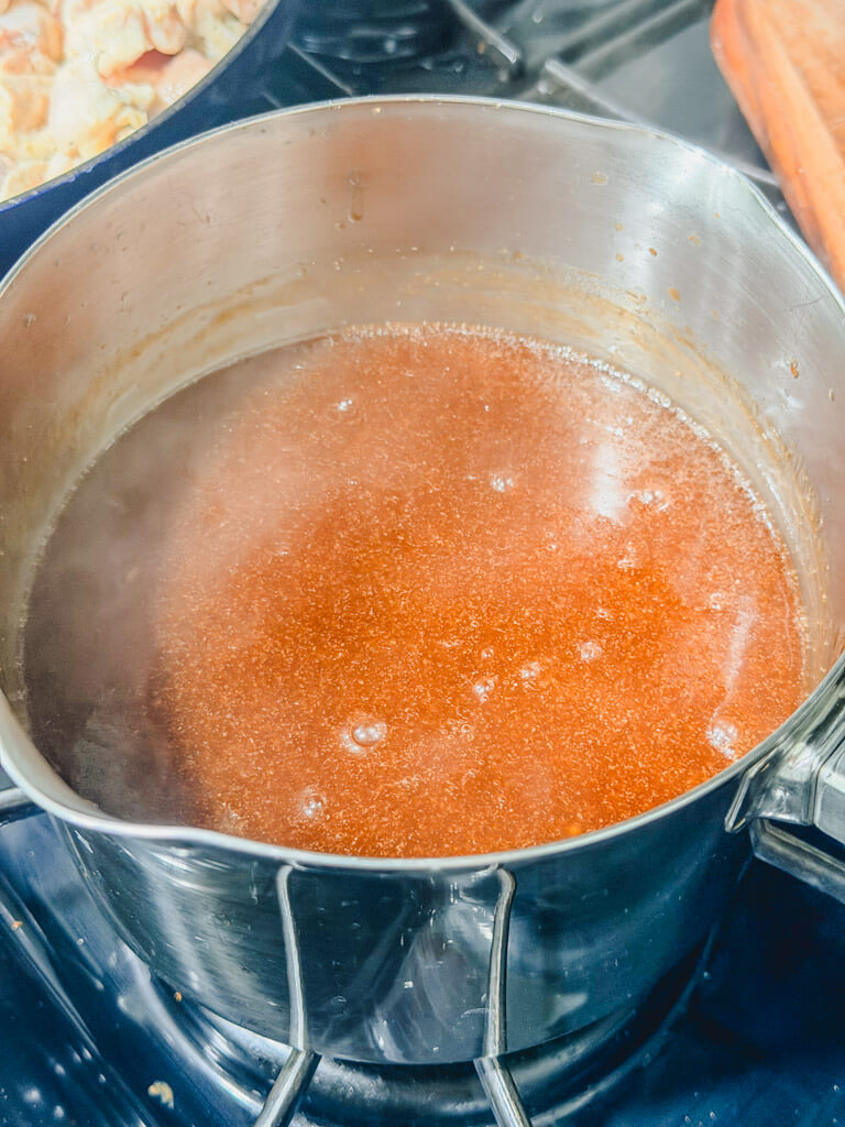 an overhead shot of the teriyaki sauce in a saucepan coming up to a simmer.