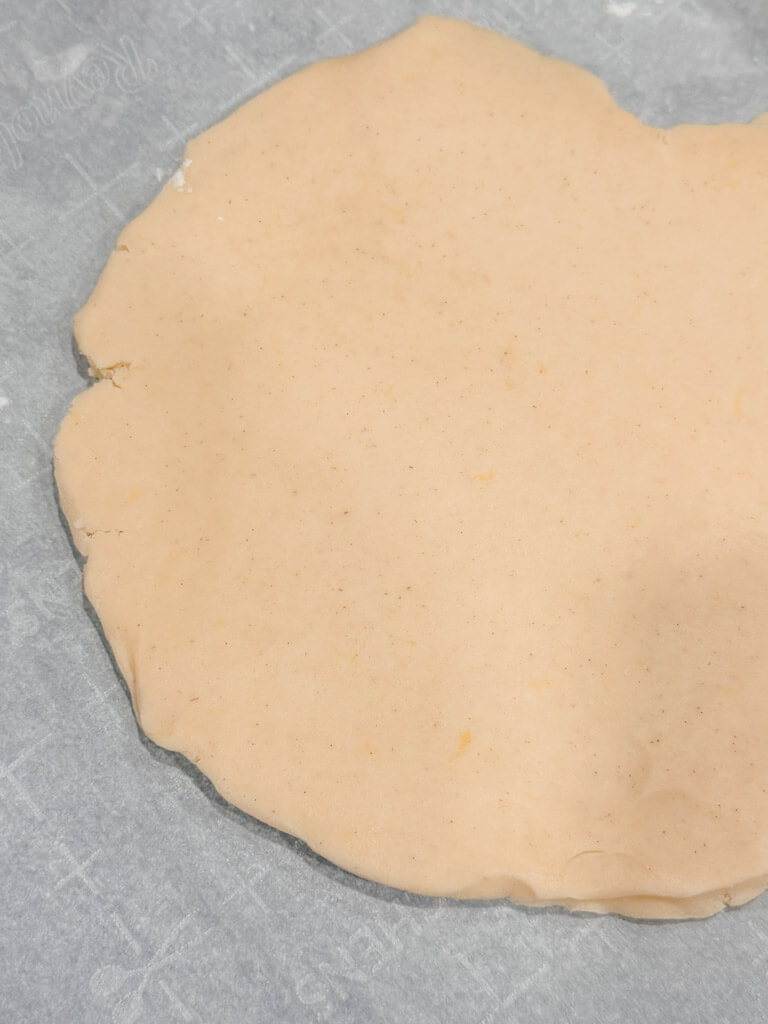 Close-up of the vanilla bean shortbread cookie dough rolled out.