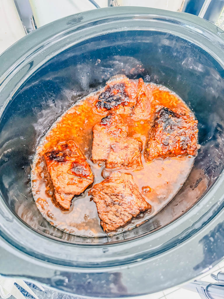 beef after slow cooking for several hours sitting in the crock pot.