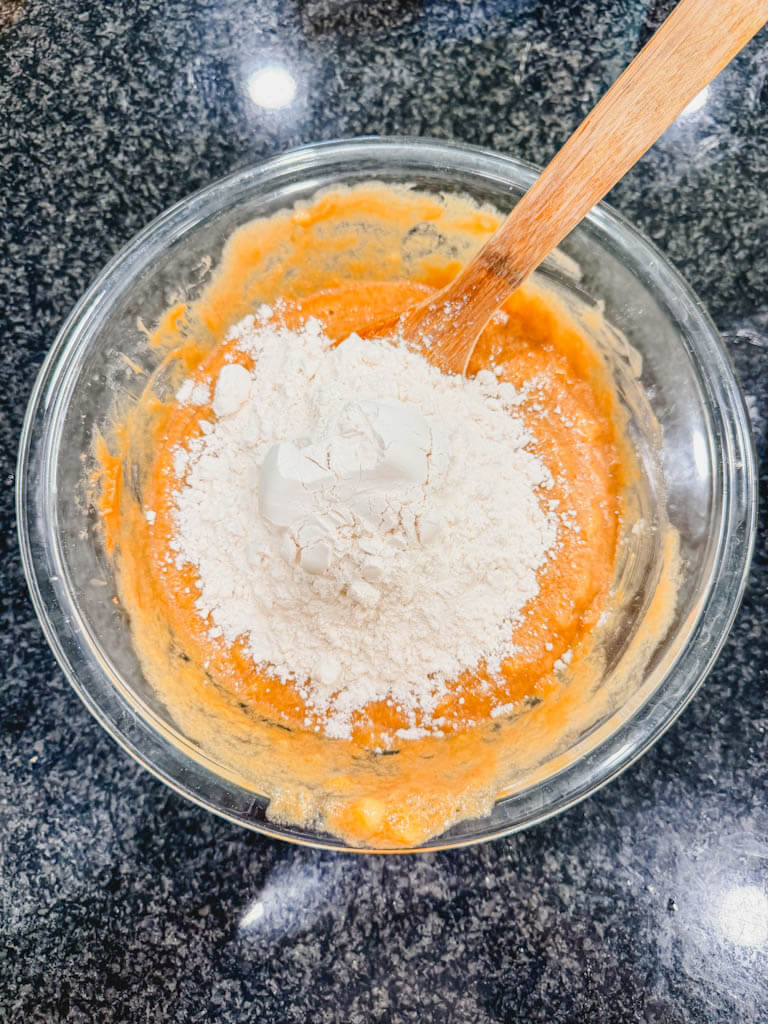 All-purpose flour added directly to wet ingredients for one-bowl Biscoff banana bread.