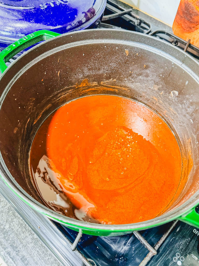 Dark brown roux in a Dutch oven ready for the gumbo vegetables.